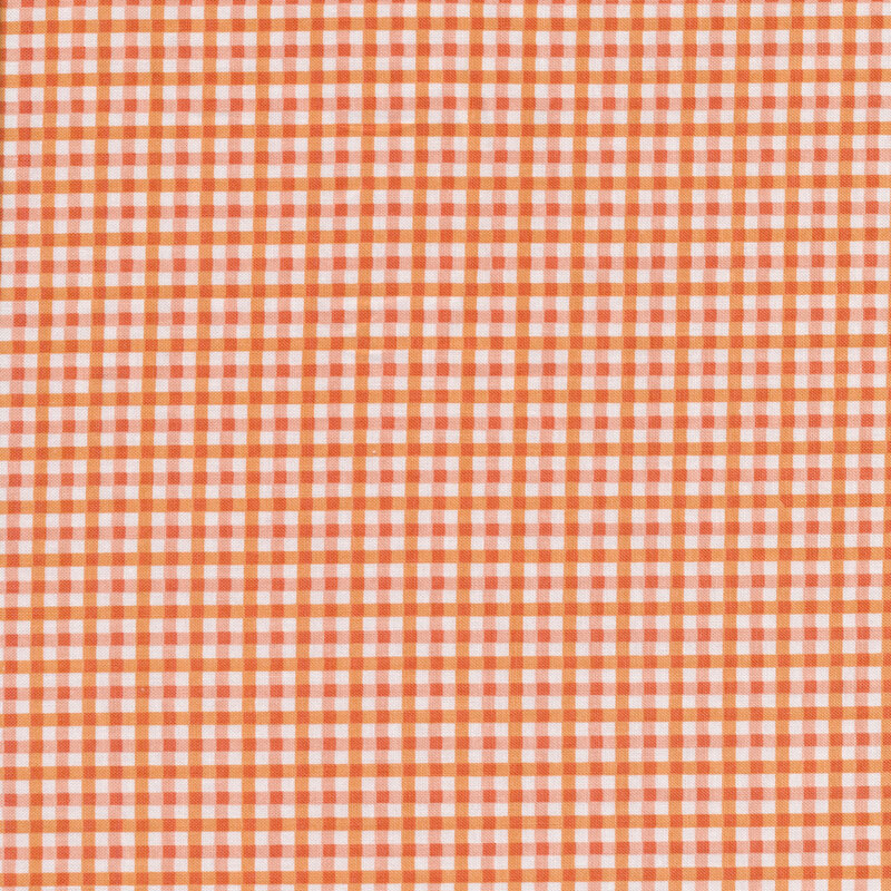 Fabric of a small orange gingham print