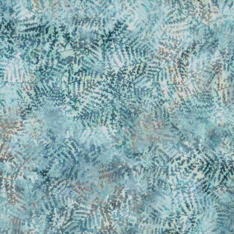 Tonal blue mottled batik fabric with dark blue sprigs scattered throughout