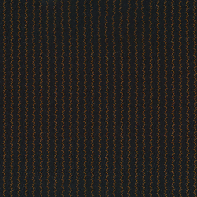 golden brown leaf stripes on a black fabric background