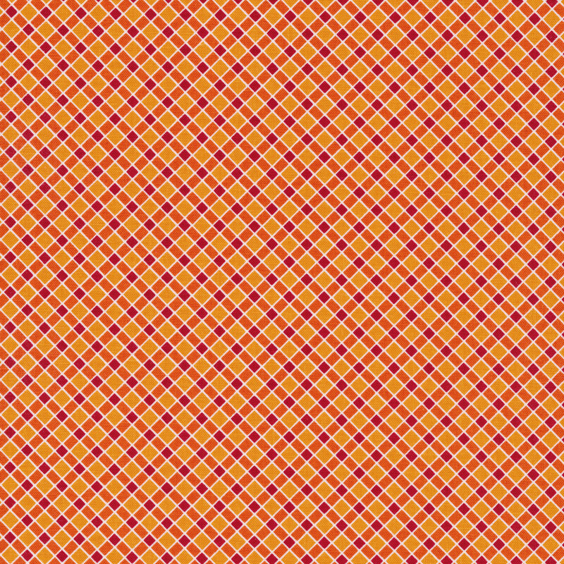 Fabric of a tonal diagonal plaid on an orange background