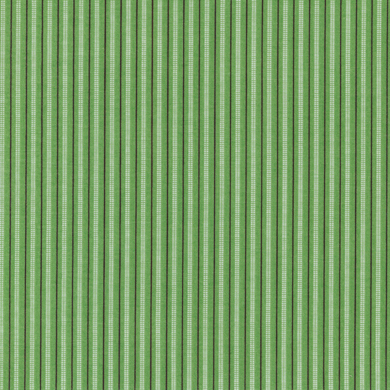 Striped fabric of large white and small black stripes on a green background