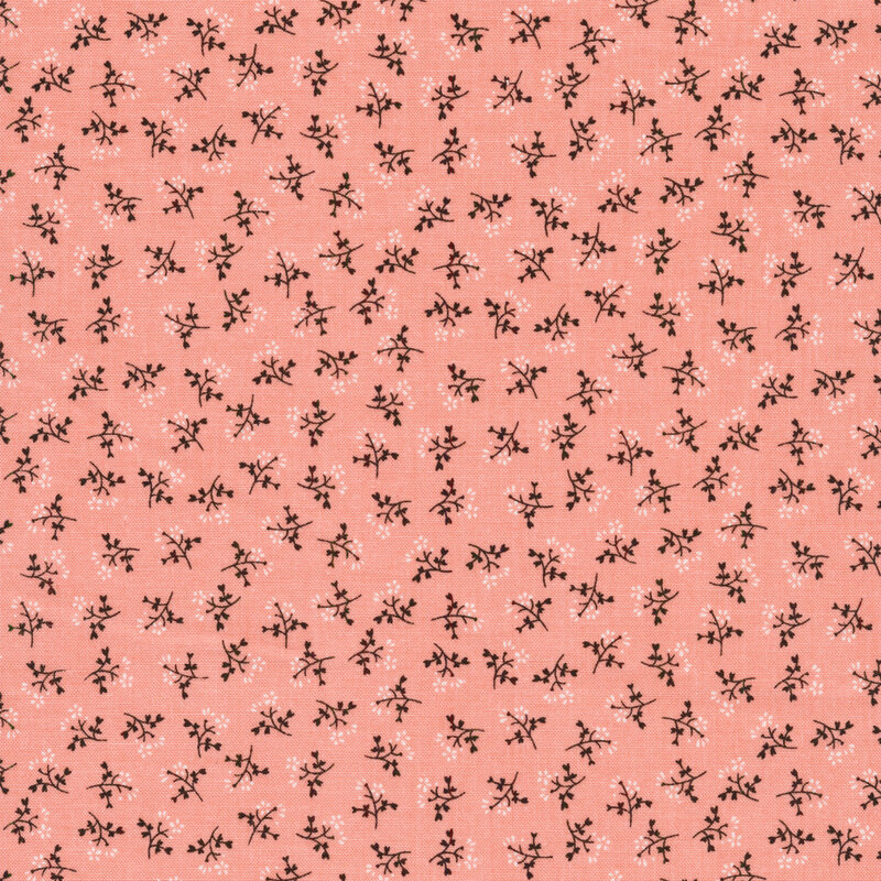 Ditsy fabric with sprigs of flowers on a pink background