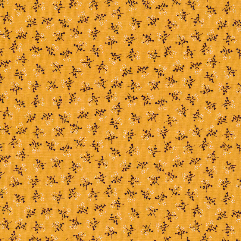 Ditsy fabric with sprigs of flowers on a yellow background