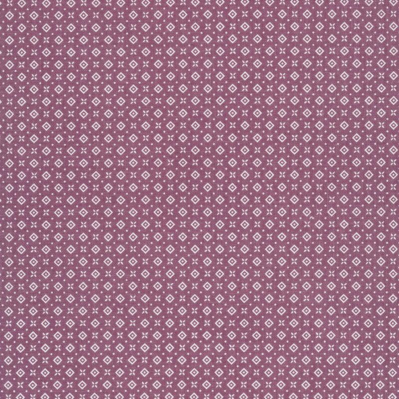 Fabric of a geometric diamond, dot, and flower print on a purple background