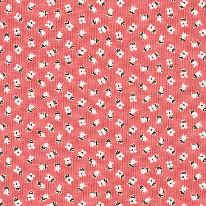 Ditsy fabric of white flowers on a pink background