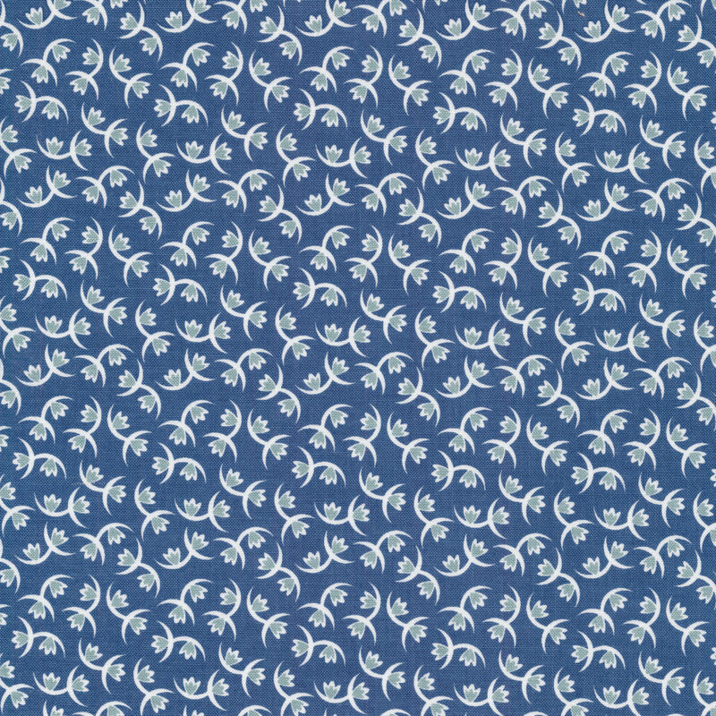 Fabric of tulips and crescents on a blue background