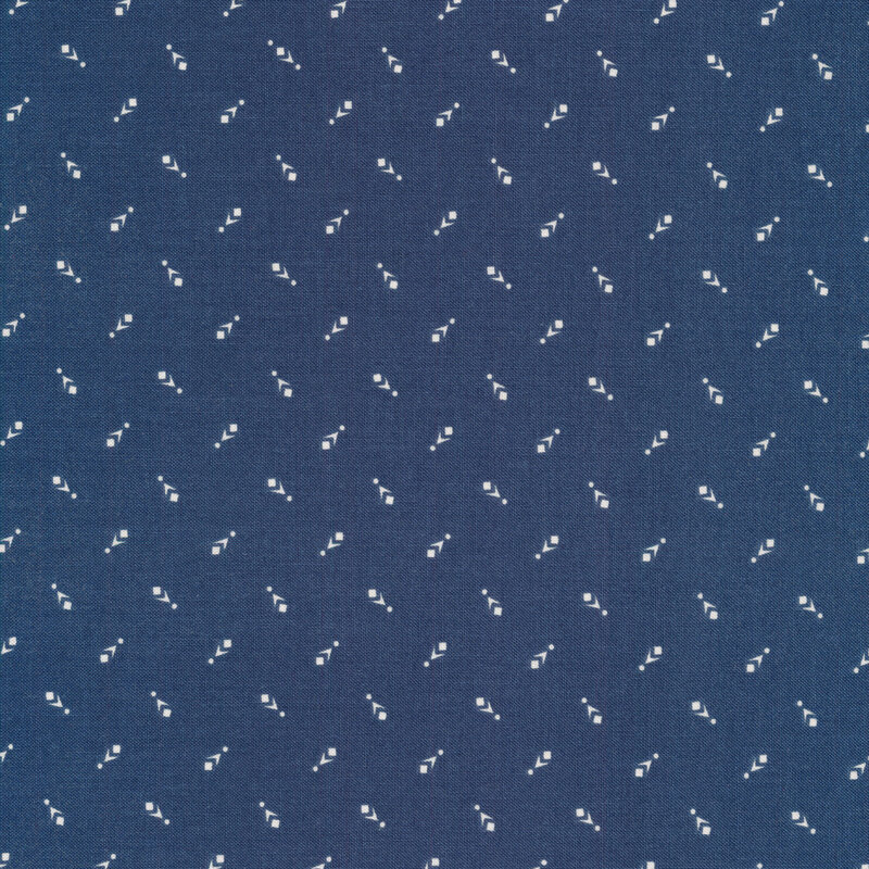 Fabric of a geometric print with small chevrons, dots, and squares on a blue background