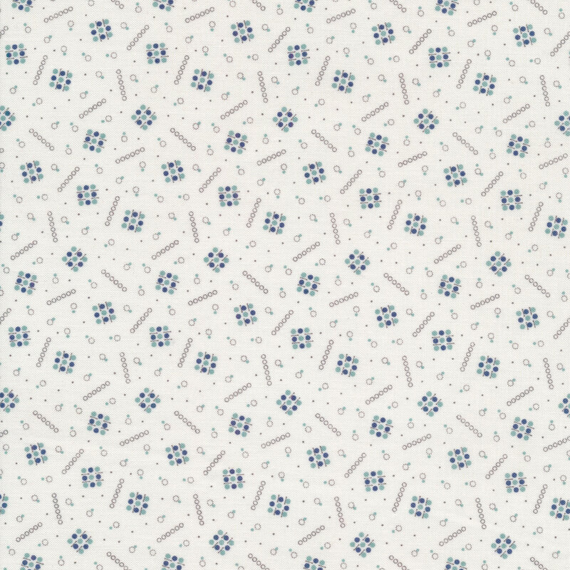 Fabric with a scattered geometric design of circles on a white background
