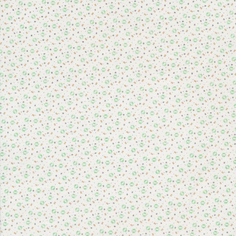 Ditsy fabric with small scattered geometric shapes on a white background