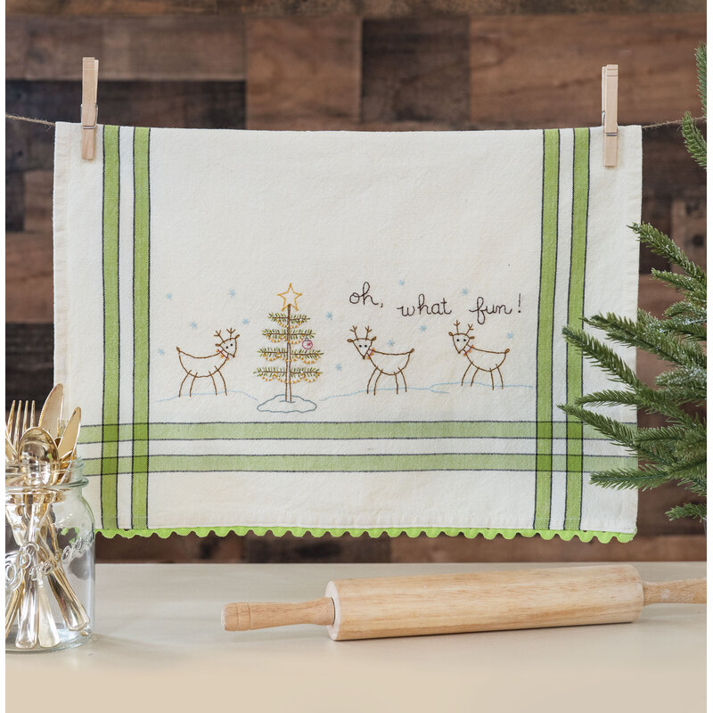 vintage kitchen towel with reindeer and a Christmas tree embroidery along with the phrase 