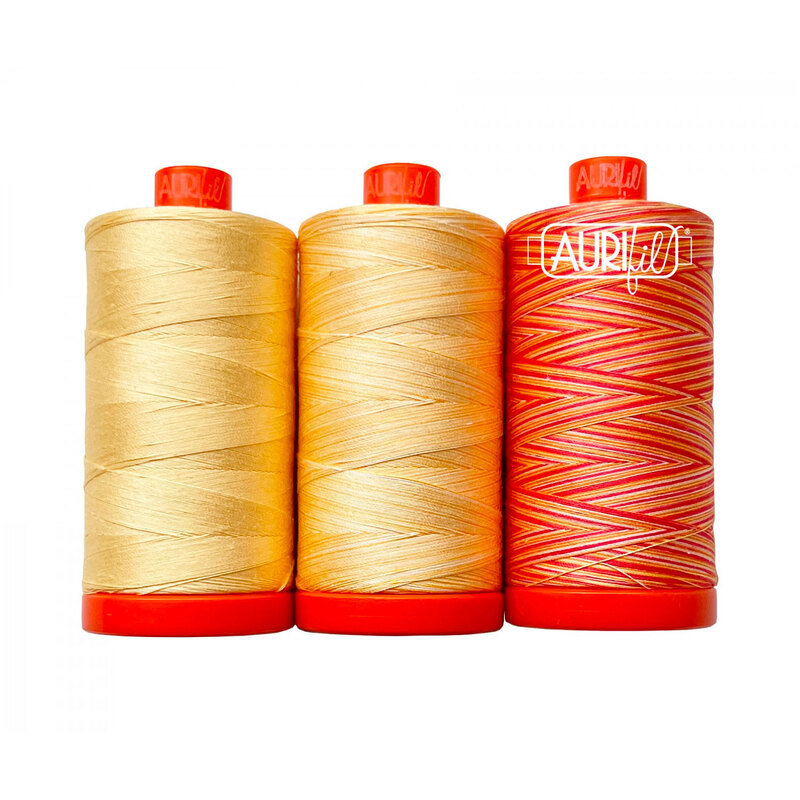 Set of three gold and yellow variegated threads from Aurifil's Bird of Paradise thread set