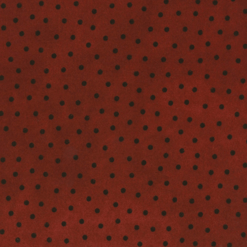 rich red mottled flannel fabric with black polka dots