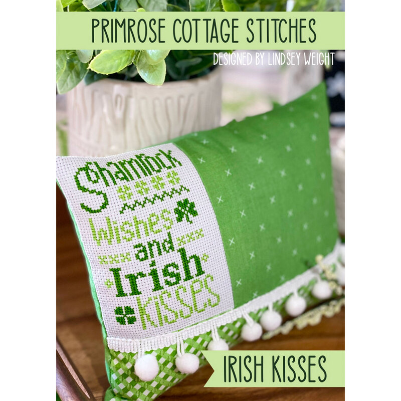 The front of the Irish Kisses cross stitch pattern by Primrose Cottage Stitches showing the finished project.