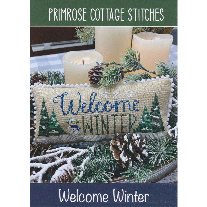 The front of the Welcome Winter Cross Stitch Pattern by Lindsey Weight for Primrose Cottage Stitches showing the finished project.