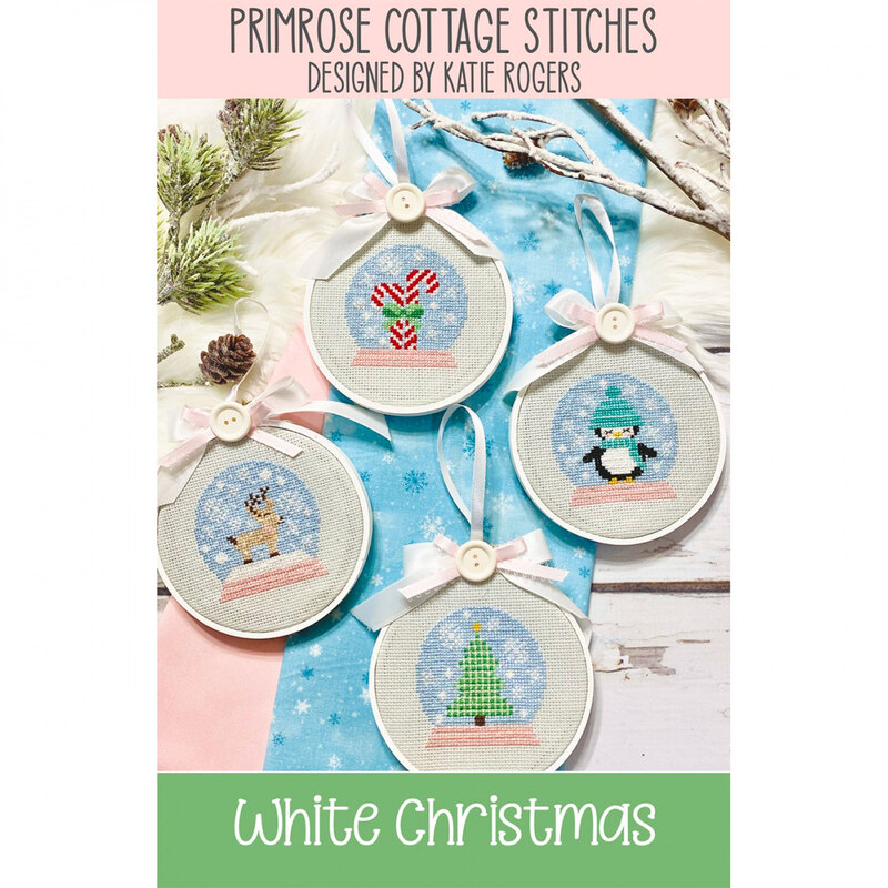 The front of the White Christmas Cross Stitch pattern by Primrose Cottage Stitches showing the finished projects.