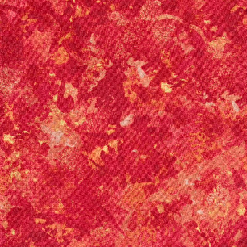 A fabric with a mottled watercolor texture in a fire engine red color