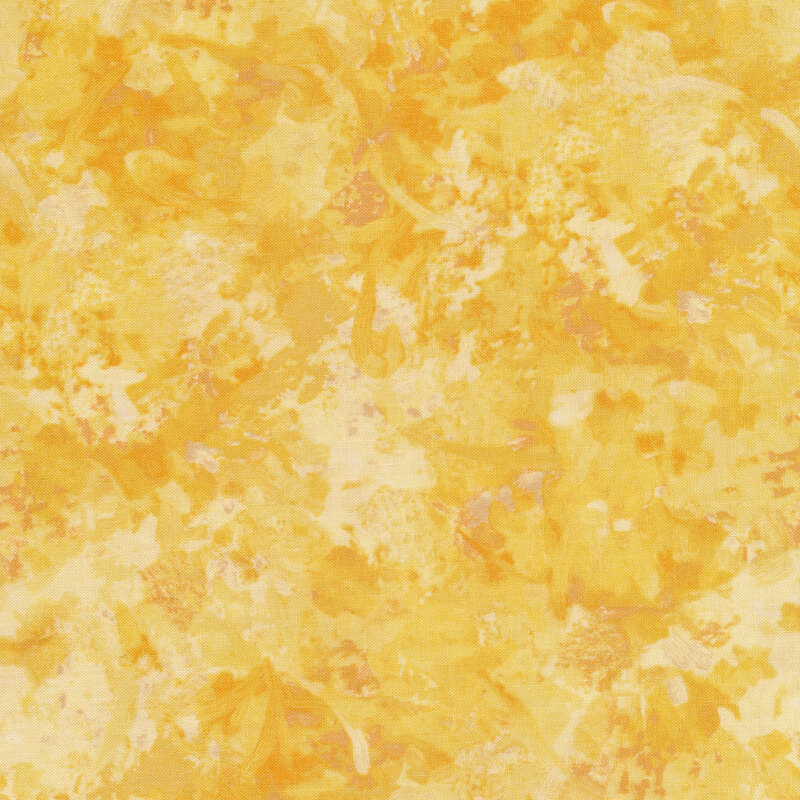 Fabric of a watercolor mottled print in a light gold color