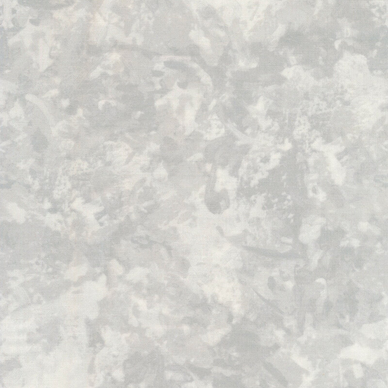 A fabric with a mottled watercolor texture in a warm white color with light gray accents