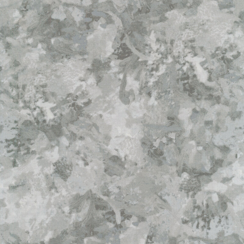 A fabric with a mottled watercolor texture in a gray color with white accents