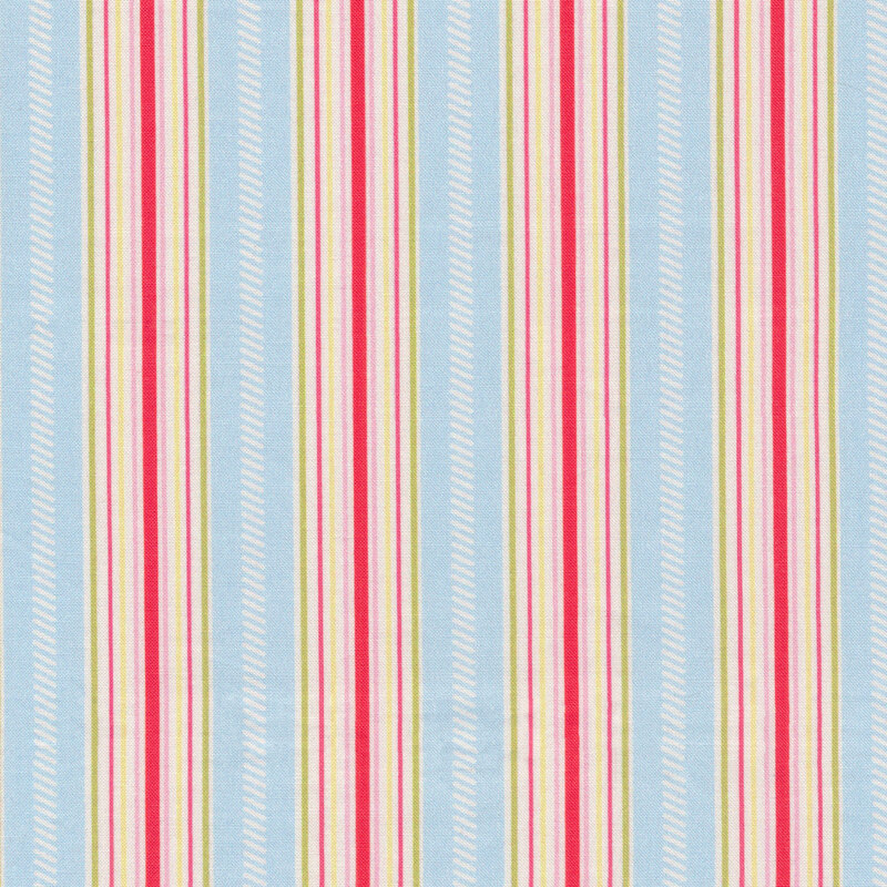 Fabric of various stripes in unique sizes, colors, and markings all on a blue background