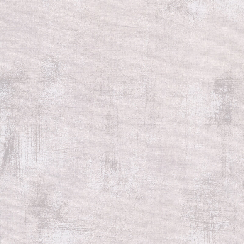 Close up of Grey Paper grunge textured fabric featuring shades of grey on white to create a distressed look