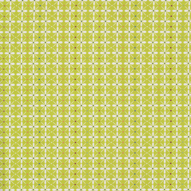 Fabric with a geometric flower pattern and small dots on a lime green background