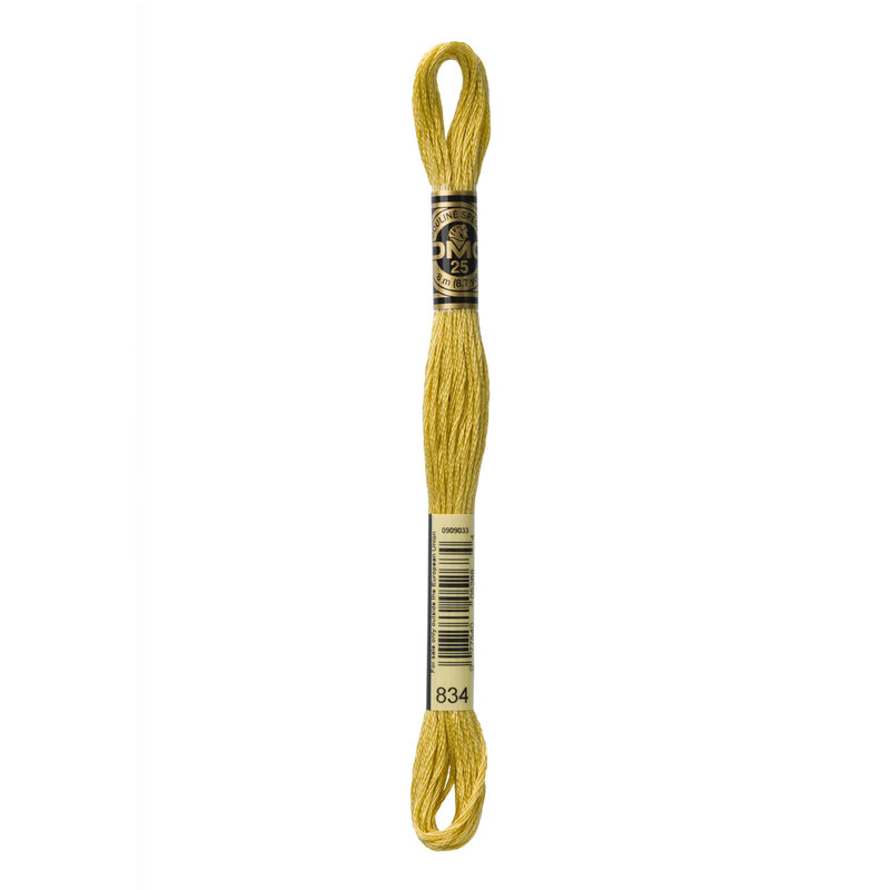 A skein of DMC 834 Very Light Golden Olive 6 strand embroidery floss