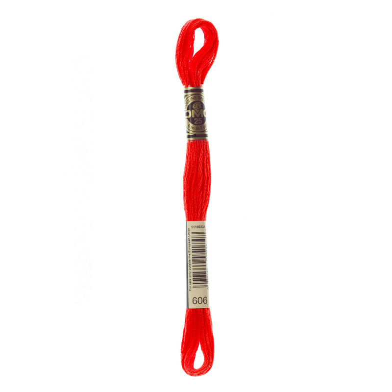 Close up image of DMC 606 Bright Orange Red embroidery floss in its packaging