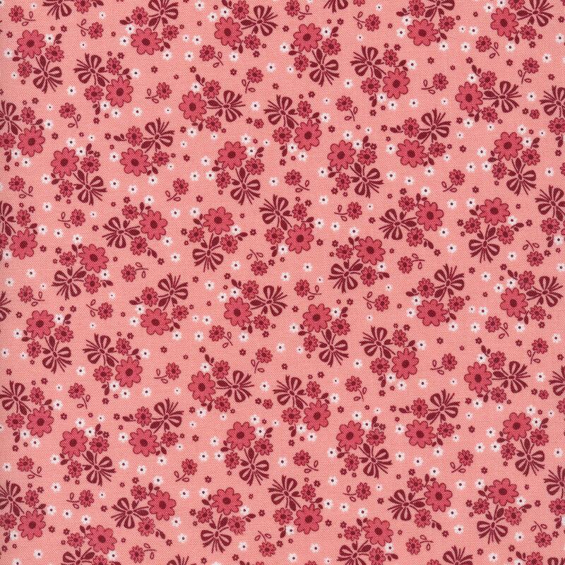 pink fabric featuring pink flowers scattered all over