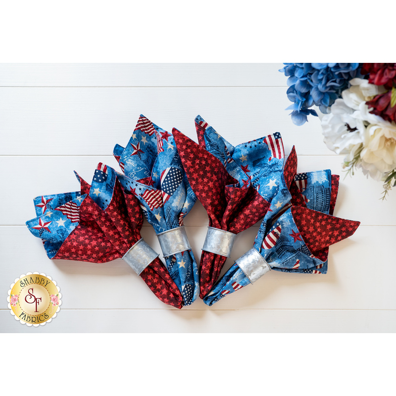 Reversible cloth napkins with blue and United States flags on one side and Red with stars on the other.