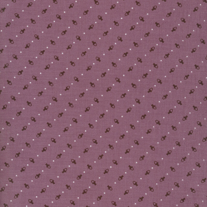 small dark purple baskets and polka dots all over a purple fabric background