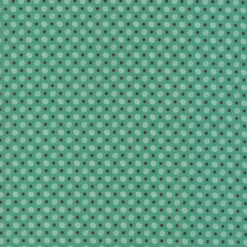 white striped polka dots and smaller brown polka dots on a green fabric background