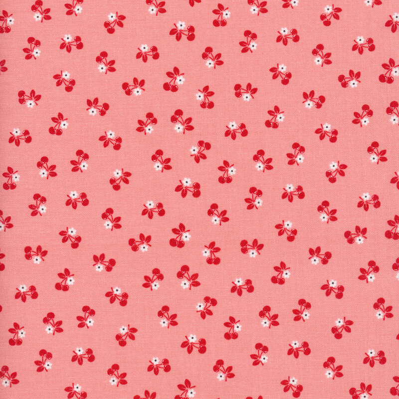 pink fabric featuring small white flowers and red cherries