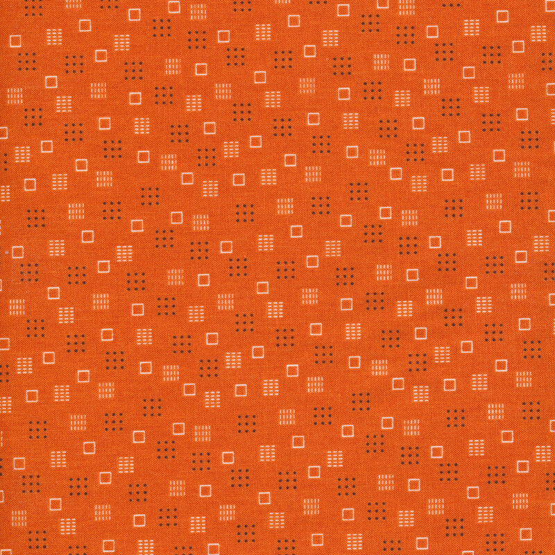 orange fabric featuring squares, polka dots, and lines