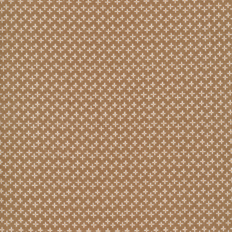 brown fabric featuring plus shaped daisies all over 
