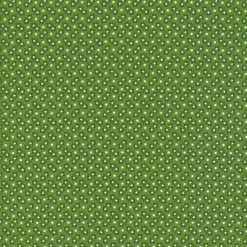 polka dots, flowers and lines on a green fabric background