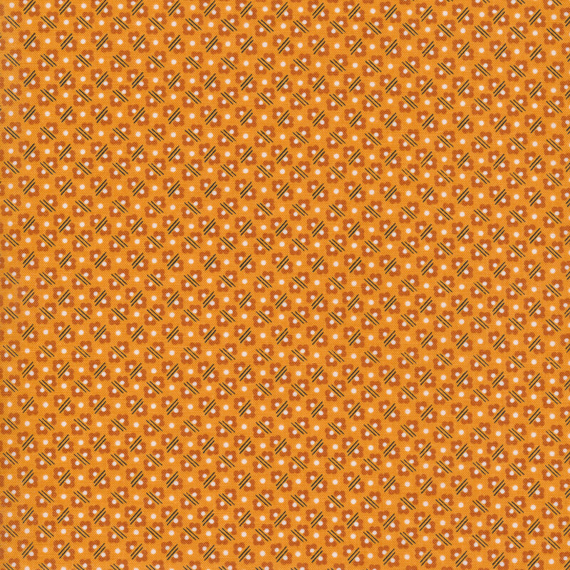 polka dots, flowers and lines on an orange fabric background