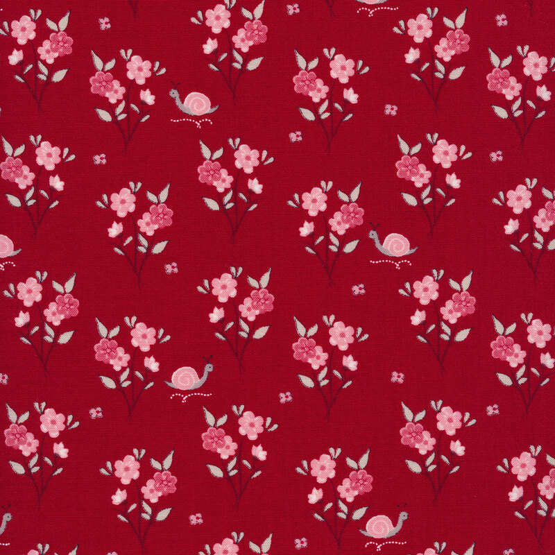 Fabric of clusters of flowers and snails on a red background