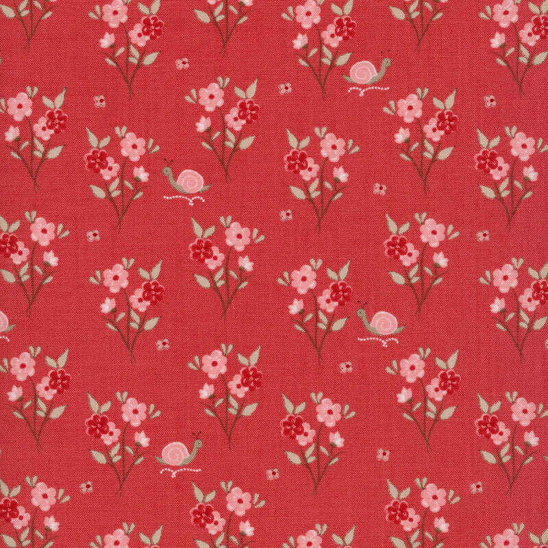 Fabric of clusters of flowers and snails on a pink background