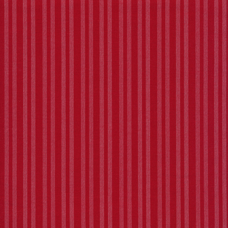 Fabric of white stripes with a ticking pattern on a red background.