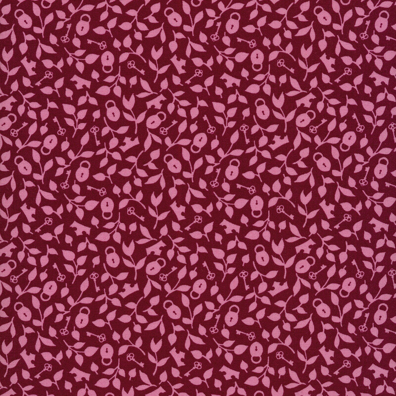 Fabric with a whimsical print of pink leaves, locks and keys, and crowns on a berry colored background