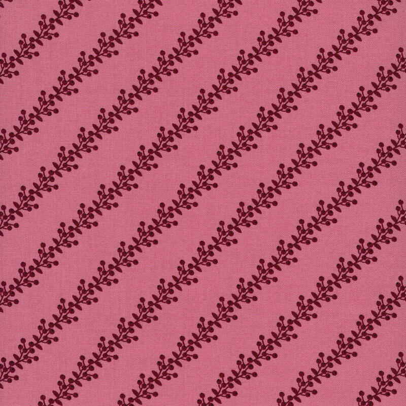 Fabric of purple berries and vines in a striped pattern on a pink background