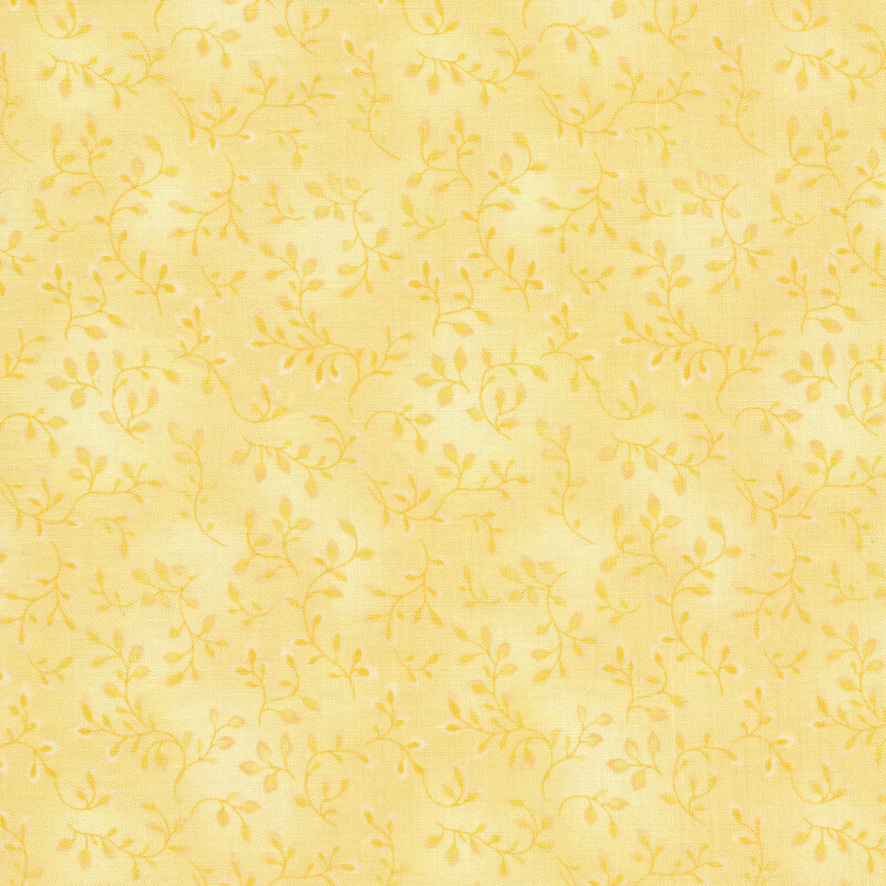 Tonal yellow fabric with leaves and vines all over