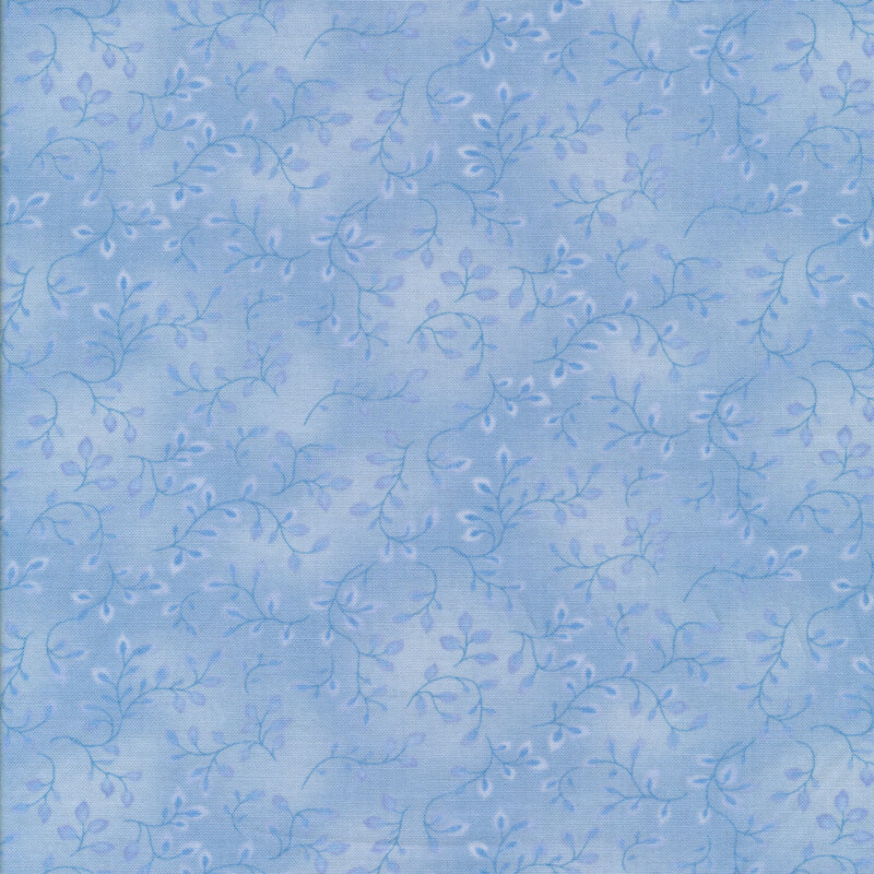 Tonal blue fabric with leaves and vines all over