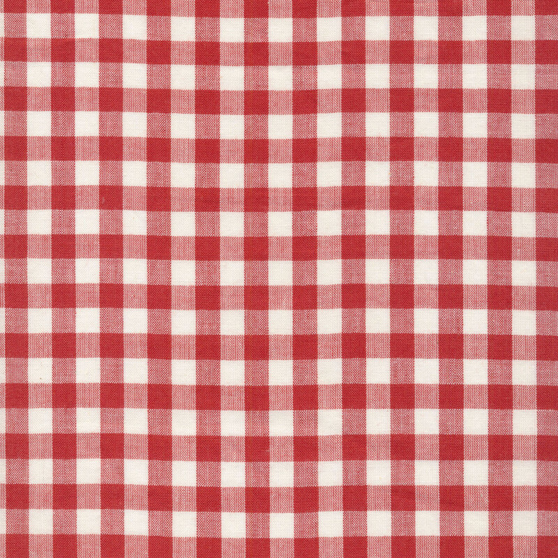 Woven fabric of a red gingham on an off-white background.