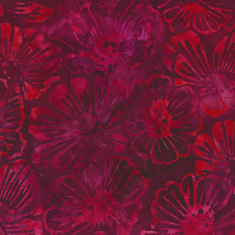 Tonal mottled fabric of red flowers on a berry colored background.