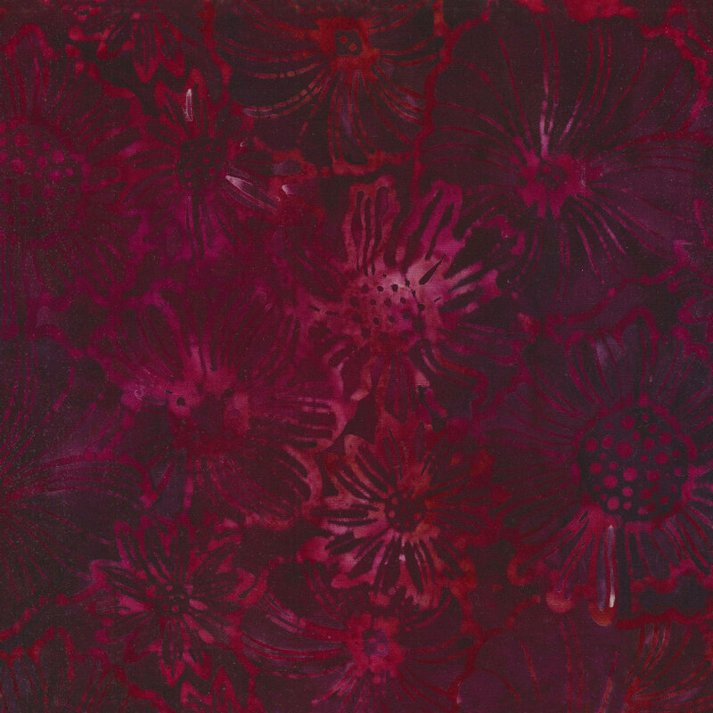 Tonal mottled fabric of red flowers on a dark berry colored background.