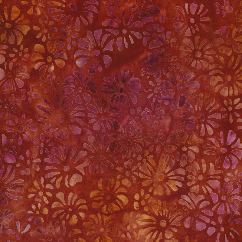 Mottled fabric of purple and orange daisies on a brick red background.