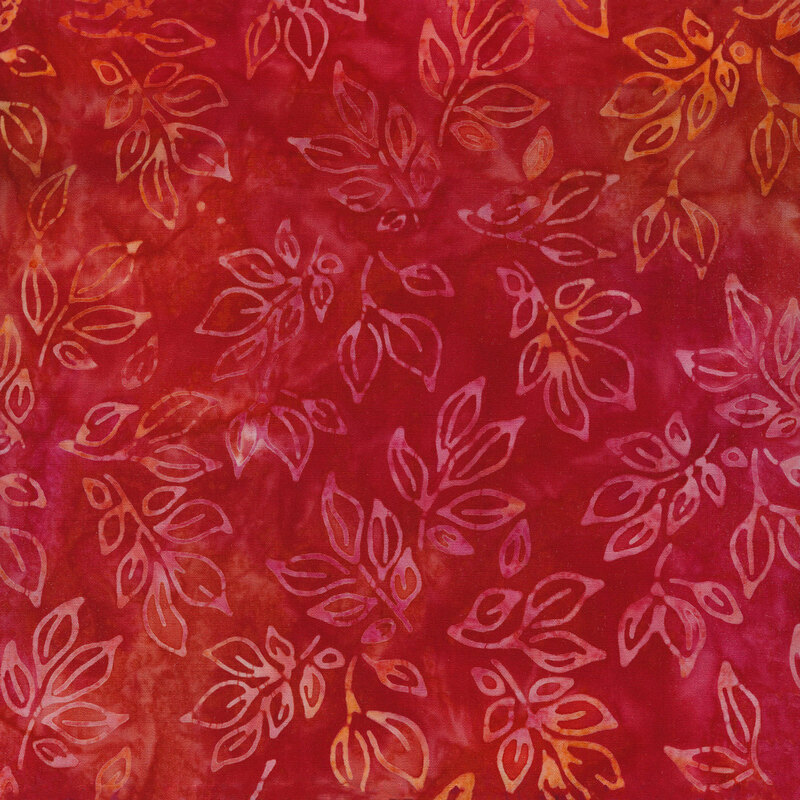 Mottled fabric of pink and orange leaves on a red background.