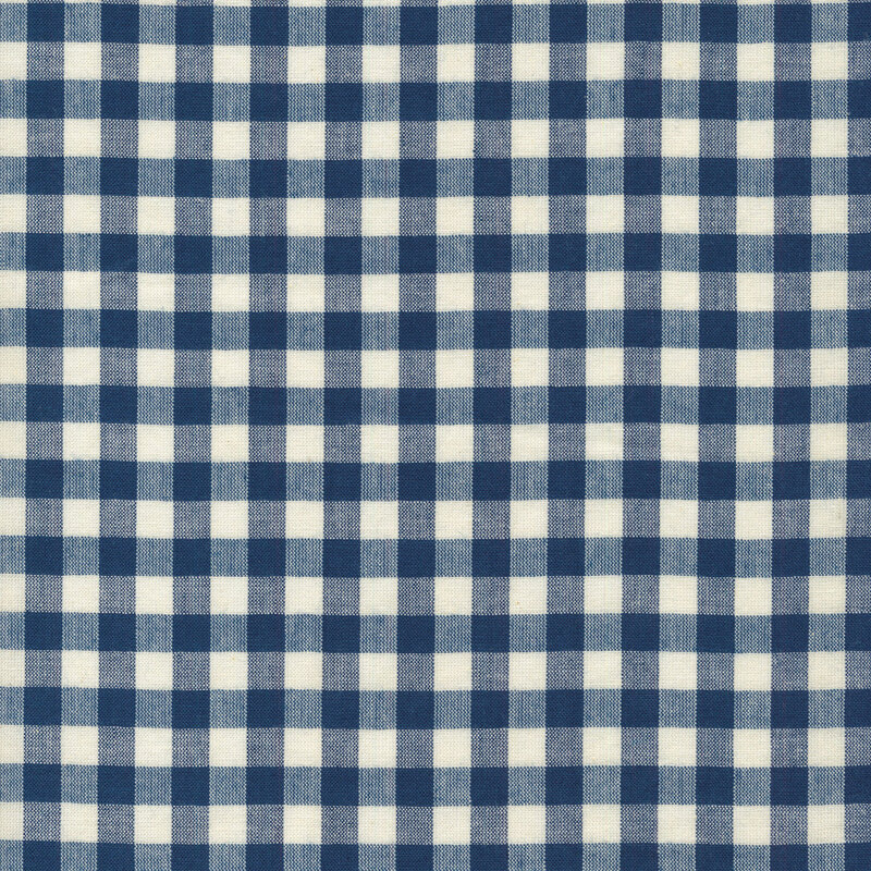 Woven fabric with a blue gingham on a cream background.